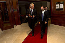 Secretary of Defense Chuck Hagel walks with The Washington Institutes executive director Robert Satloff.jpg