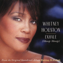 The face of a woman smiling. She has a brunette hair and is wearing dark-colored lip color. To the right of the image, the words "Whitney Houston" are printed, below which are the words "Exhale" and "Shoop Shoop". To the bottom of the image, "From the original soundtrack album Waiting to Exhale" is printed.