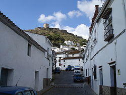View of the medieval castle of Jimena de la Frontera as seen from one of its streets.
