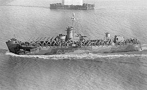 USS LSM(R)-194, of the LSM(R)-188 Class, passing under the Cooper River Bridge, Charleston, SC, 2 December 1944.
