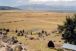 The archaeological site of Inkawasi with the volcano Sara Sara and the lake Parinaqucha in the background
