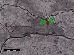 The village centre (red) within the statistical district (green) of Opheusden and municipality (dark grey) of Neder-Betuwe
