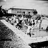 Nude outdoor recreational swimming for children in Israel, c1950