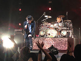 Shinya (right) performing with Luna Sea in Singapore 2013