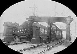 "Railway bridge, in an unidentified location" is likely on the Dublin-Drogheda line north of Amiens street, Dublin (27588131071).jpg