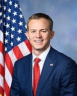 Upper-body portrait of a twentyfirst-century man in a suit.