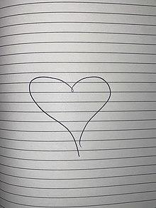 A drawn love heart on paper