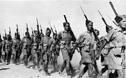20th Battalion infantry marching in Baggush, Egypt, September 1941.jpg