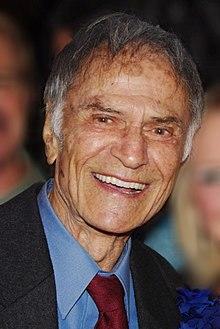 Jerry Springer Larry Storch Geri Reischl 2011 David Shankbone (cropped).JPG