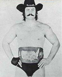 Blackjack Mulligan with a championship belt.jpg