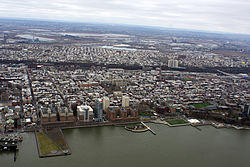 An aerial view of Hoboken from above the Hudson River