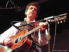 Penn playing guitar