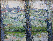 A close view of three blossoming trees behind which can be seen a large orchard and field in which a man is working, a village filled with buildings and houses in the background, under a bright sky