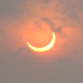 Solar eclipse at sunset (2937676527) (cropped).jpg