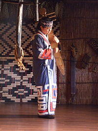 Woman playing traditional Ainu instrument.jpg
