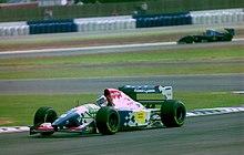 Gianni Morbidelli - Footwork FA15 at the 1994 British Grand Prix (32418632251).jpg