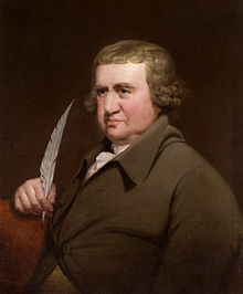 Painting of a man wearing 18th century clothes and holding a quill pen.