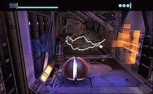 A metallic ball stands in a futuristic corridor, with sparks of electricity in the background. Atop the image is a bar and a number indicating the health of the player, and three round icons indicating the remaining bombs.
