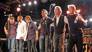 Mike + The Mechanics in 2012 L-R: Ben Stone, Andrew Roachford, Tim Howar, Luke Juby, Mike Rutherford and Anthony Drennan