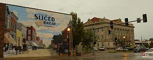 Livingston County Courthouse with mural depicting the community being the home of sliced bread. The district around the courthouse is on the National Register of Historic Places.