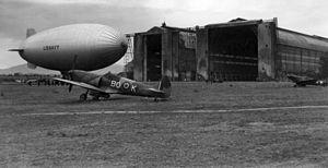 USN blimp with RAAF Spitfires at Cuers-Pierrefeu 1944.jpg