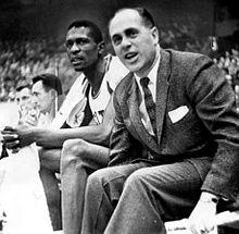 Auerbach and Russell seated on the sidelines
