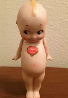 German Kewpie with Heart Sticker.png