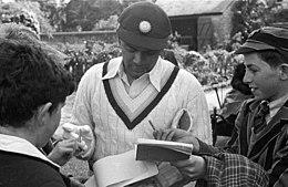 Cricketer B. B. Nimbalkar giving autographs, c. May 1, 1946.jpg