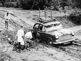 Car stuck in mud, Mangal Tarai, India, 1973 (16880601509).jpg