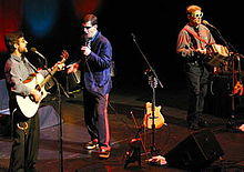 From left to right, Wayne Chaulk, Kevin Blackmore, and Ray Johnson, performing in typically offbeat garb.