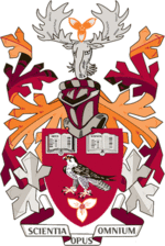 Coat of Arms of Mohawk College with primarily burgundy, crimson, and orange colours.