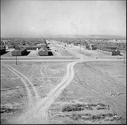 Topaz, Utah. Looking down a main thoroughfare at the Topaz Relocation Center. - NARA - 538677.jpg