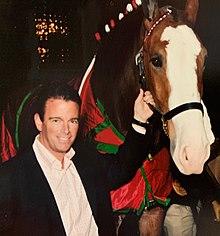 August A. Busch IV with Budweiser Clydesdale.jpg