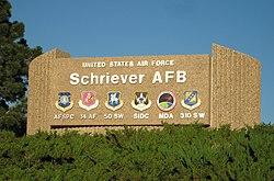 Sign with emblems of units based at Schriever AFB