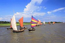 Boats with brightly-coloured sails