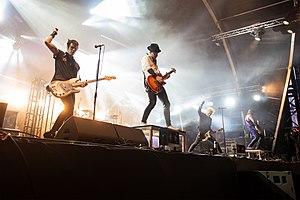 Sum 41 at Hellfest 2019. from left to right: Bassist Jason McCaslin, drummer Frank Zummo, guitarist Tom Thacker, singer Deryck Whibley, and guitarist Dave Baksh.