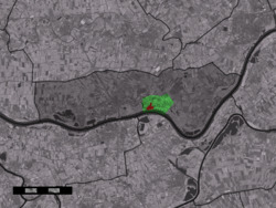 The village centre (red) and the statistical district (light green) of Opijnen in the former municipality of Neerijnen.