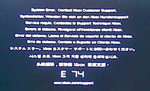 The error code E74. Above the large E 74 code is the message "System Error. Contact Xbox Customer Support." repeated in different languages.