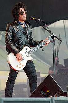 Steve Conte performing at the 2011 Ilosaarirock festival with Michael Monroe band.