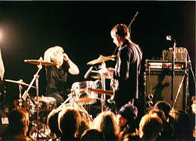 Vocalist and guitarist Justin Trosper and drummer Sara Lund performing with Unwound