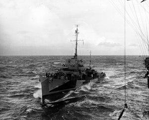 USS Moore (DE-240) coming alongside the escort carrier USS Core (CVE-13) in the Atlantic Ocean on 9 April 1945 (NH 45727).jpg
