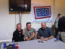 James Gandolfini, The Sopranos co-star Tony Sirico, and a soldier posing for a photograph