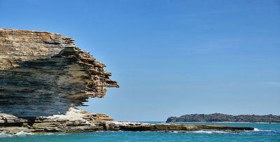 Rock formations on a small island within the group