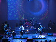 Steve Hillage Band (June 19, 2009), from left: Miquette Giraudy (keyboards), Steve Hillage (guitar), Chris Taylor (drums) and Mike Howlett (bass).