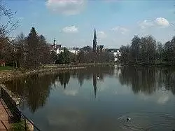 View across pond towards Martin Luther church and town hall