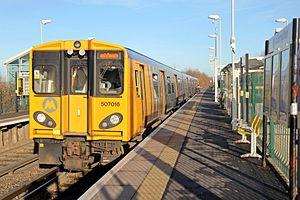 Merseyrail Class 507, 507016, Old Roan railway station (geograph 3786839).jpg