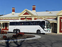 Photo of an Austral Denning 'Majestic' bodied Volvo B12R (13.5 m) owned by Moreland Buslines leaving Wagga Wagga Railway Station operating the dual Greyhound Australia/Firefly Melbourne to Sydney service, 2009.
