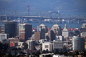 Oakland skyline, with the eastern span of the San Francisco–Oakland Bay Bridge in background