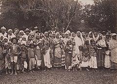 East Indian Women, Men and Children (13227675614) (cropped).jpg