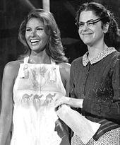 Welch, laughing, onstage with Radner as Emily Litella